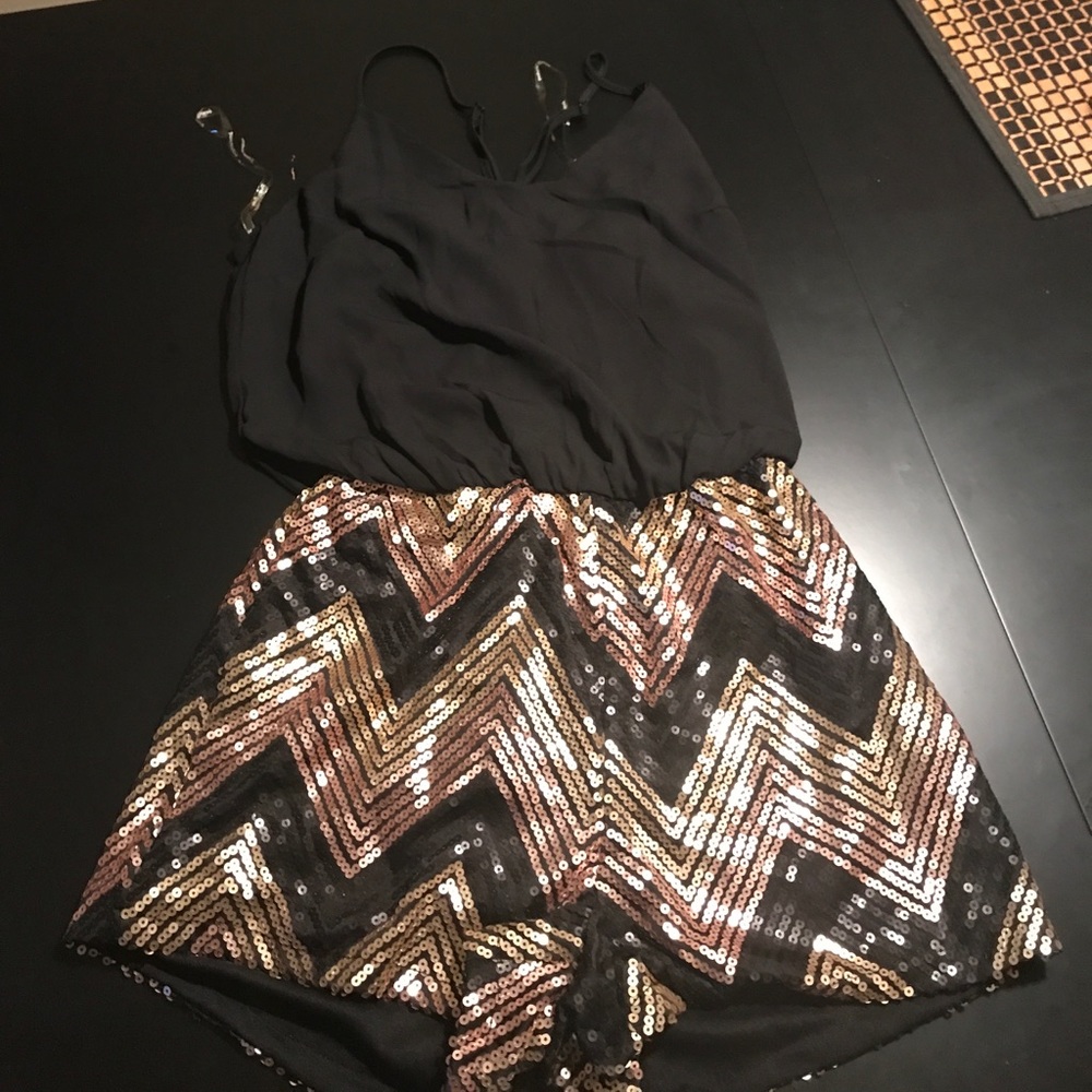 Romper size small black and gold