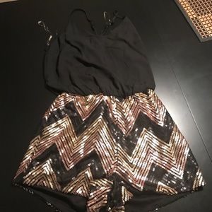 Romper size small black and gold