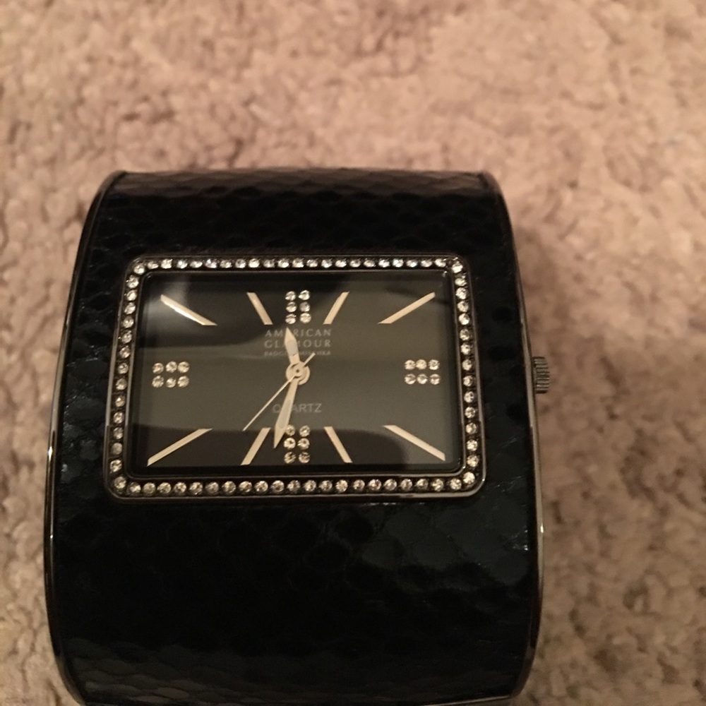 Black badgley mischka watch.. it needs a battery.