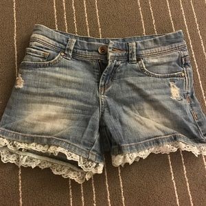 Distressed jean shorts with lace