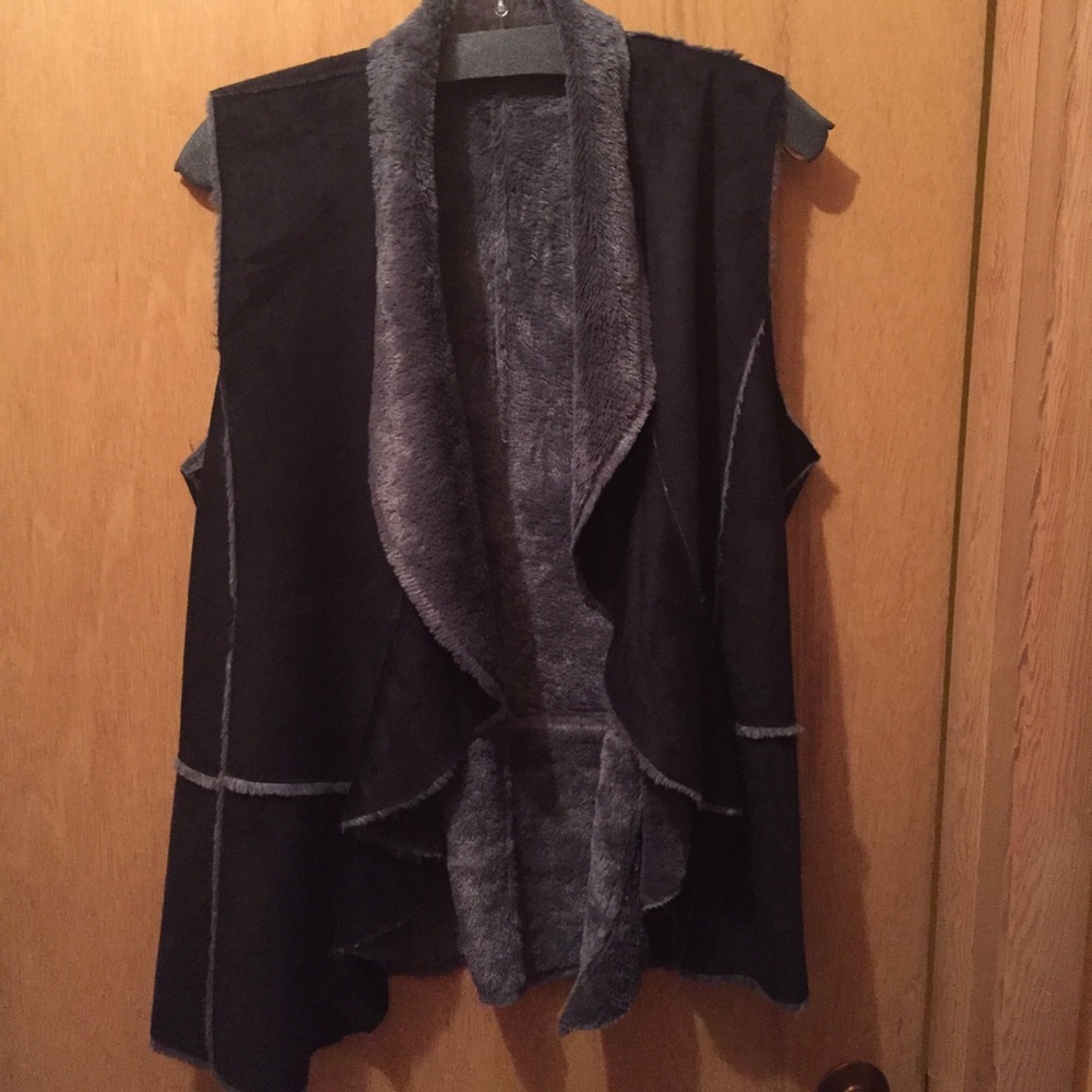 Faux shearling draped open vest.
