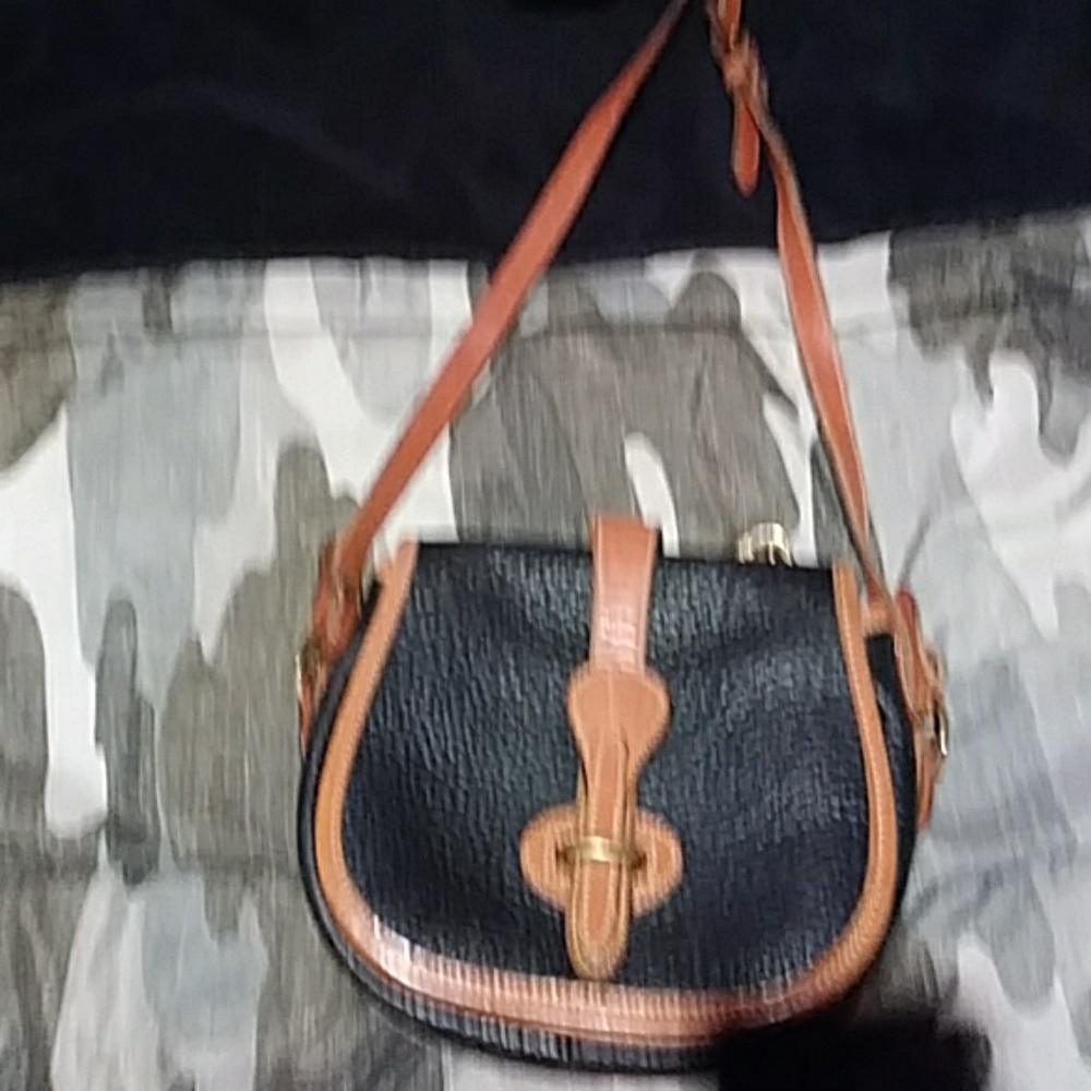 Small black and brown leather purse.