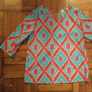 Blouse with Blue, Orange, and Pink Ikat print.