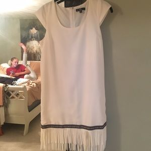 White dress with Aztec print trim and fringe
