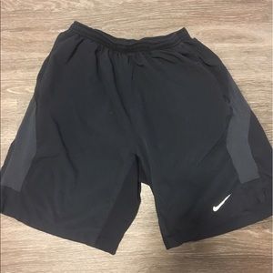 Men's black Nike running shorts.