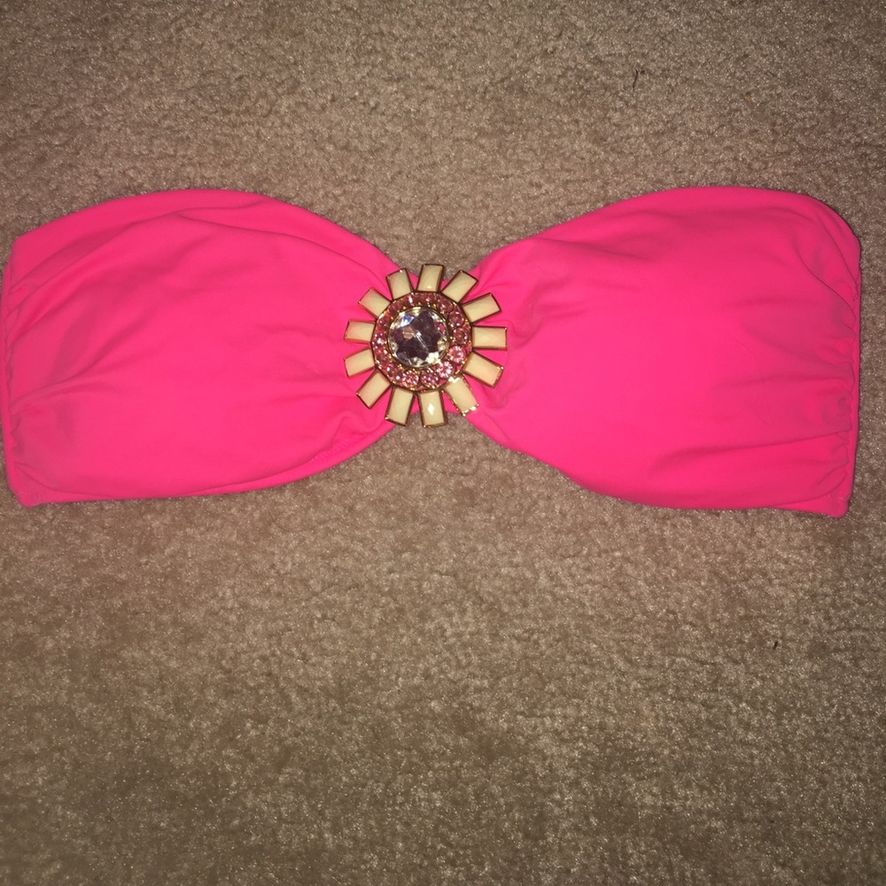 Pink strapless bathing suit with jewels in middle