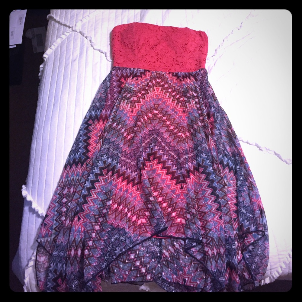 Strapless coral colored dress.