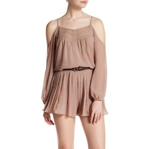 Pink romper with adjustable straps and belt