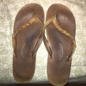 Braided rainbow flip flops