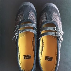 Onitsuka Tiger by Asics black slip-on sneakers.