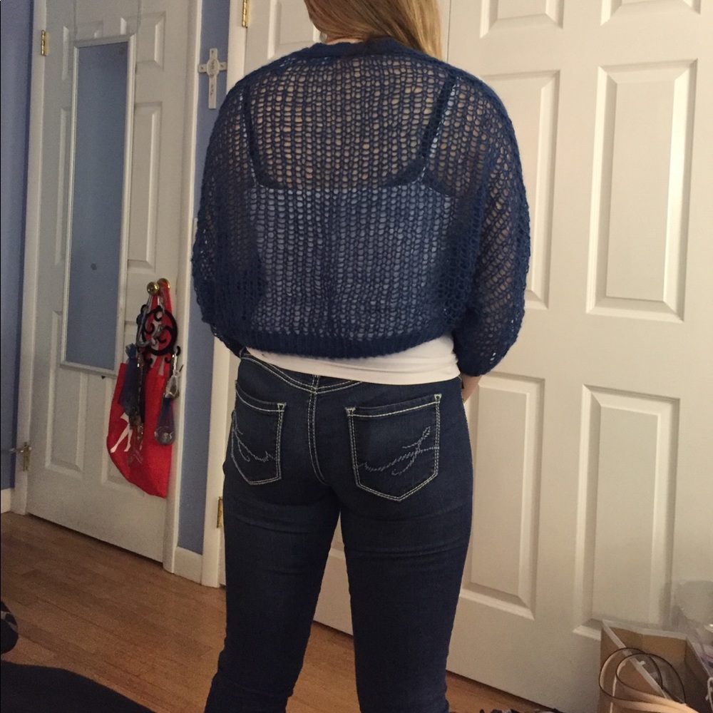 A blue see through crop top