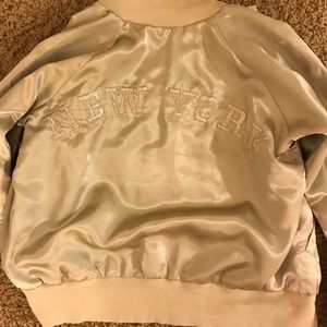 LF gold bomber w New York on the back