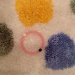 It is a bracelet pink black and white