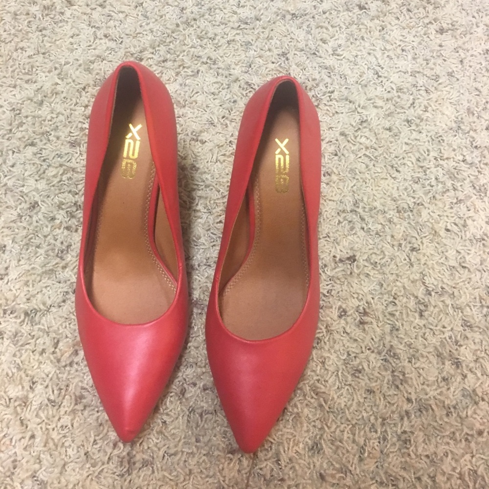 Red leather pumps