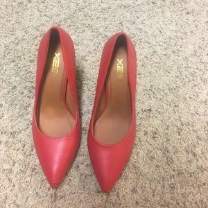 Red leather pumps