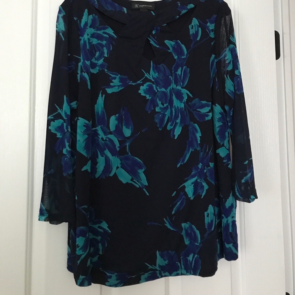 Lined print top 100% nylon Cut out yoke neckline.