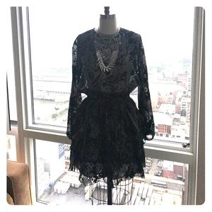 Cocktail dress with layers and sheer top