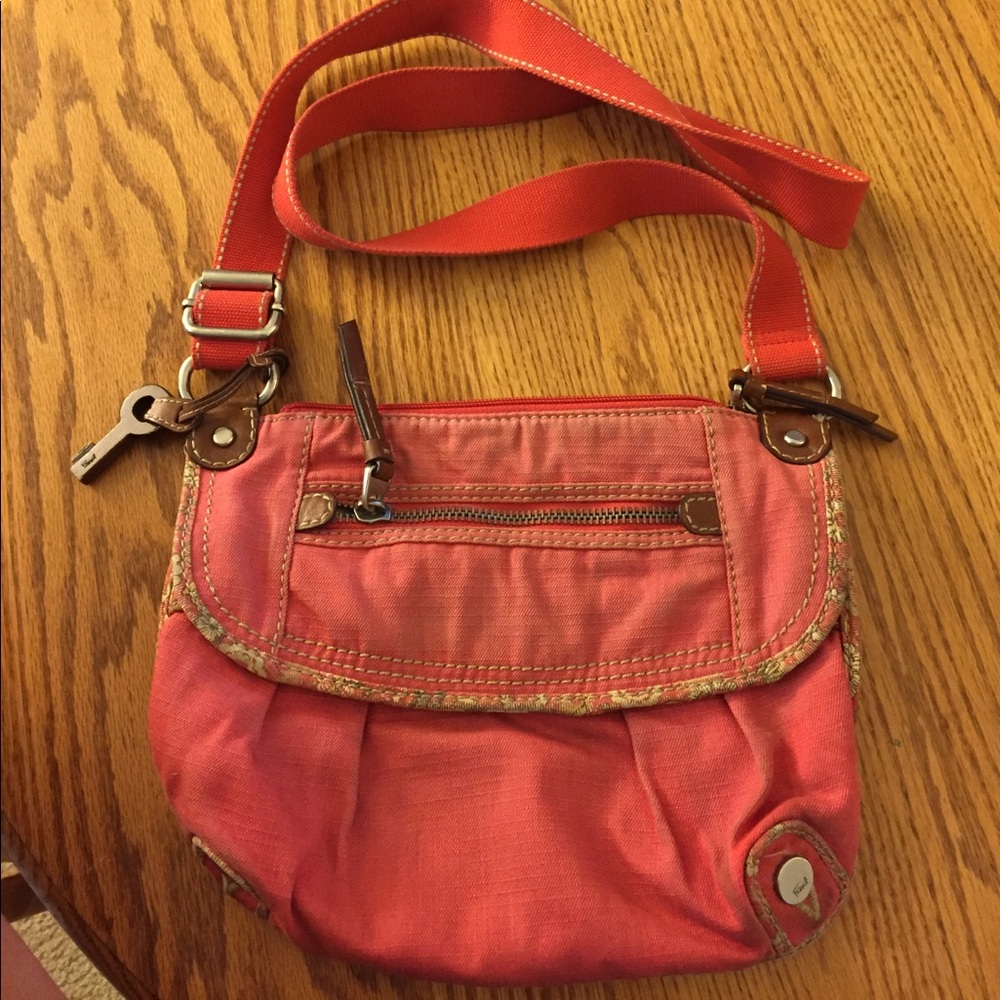 Used good condition coral Fossil cross body purse