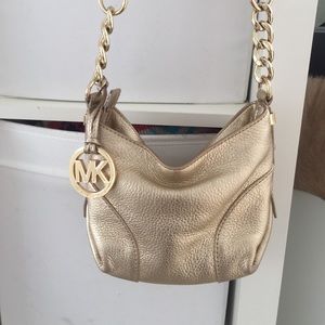 Michael kors gold cross the body bag
