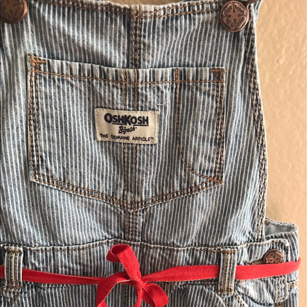 OshKosh pin striped denim overalls.