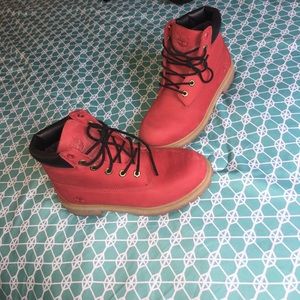 Red and black timberland high top boots