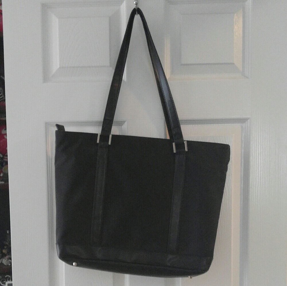 Laptop bag with holding pad and cooling fan