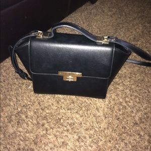 Still has tags in the inside of purse