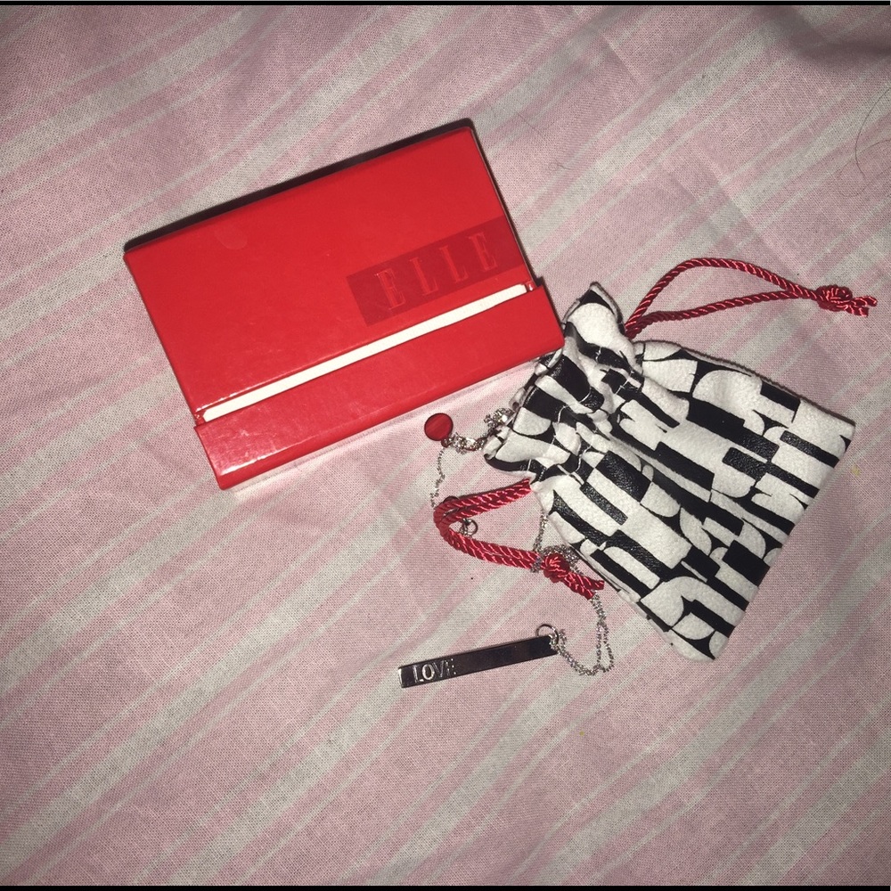 Sterling silver "love" necklace. red rhinestone