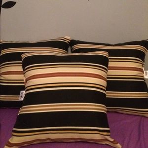 3 striped pillows can be used for indoor/outdoor