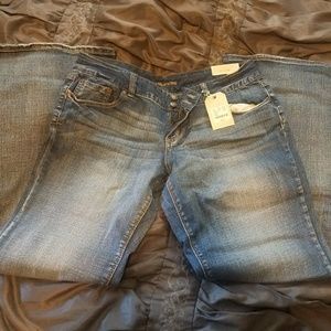 Size 15/16 long, flare bottom light wash jeans