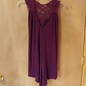 Tunic size Med. Purple in color.