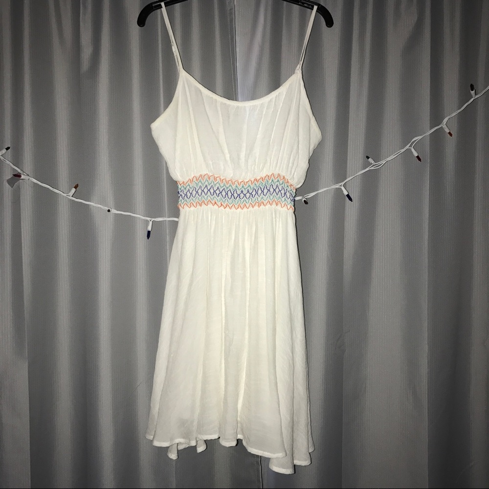 White sundress with fitted colorful waist