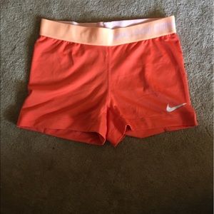 Orange Nike pros