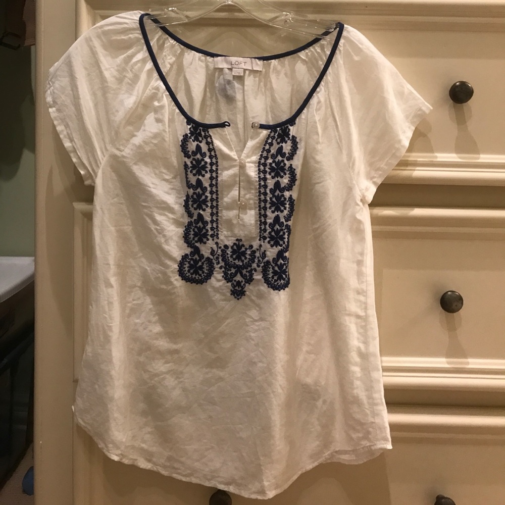 Embroidered blue and white top