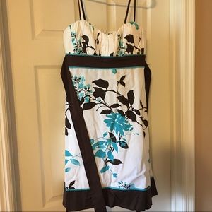 White dress with brown and teal flowers