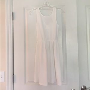 White party/day dress with bow on back.