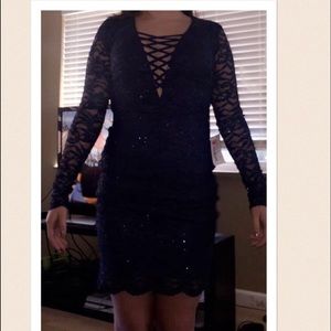A blue formal sparkly tight fitting dress