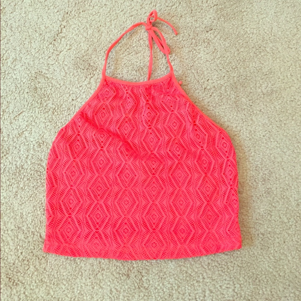 Bright orange/red crop top.