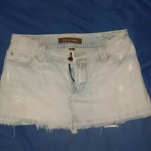 Light wash, distressed denim mini skirt