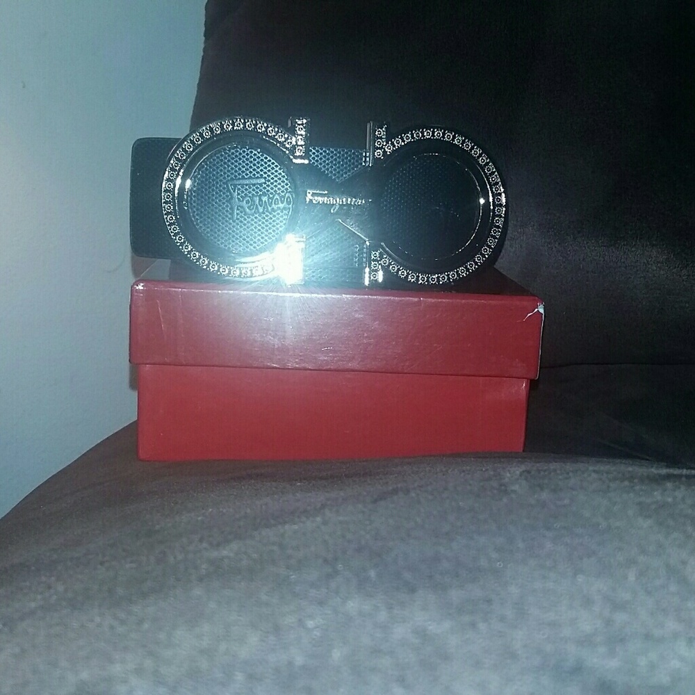 A ferragamo belt, black with vs gold buckle