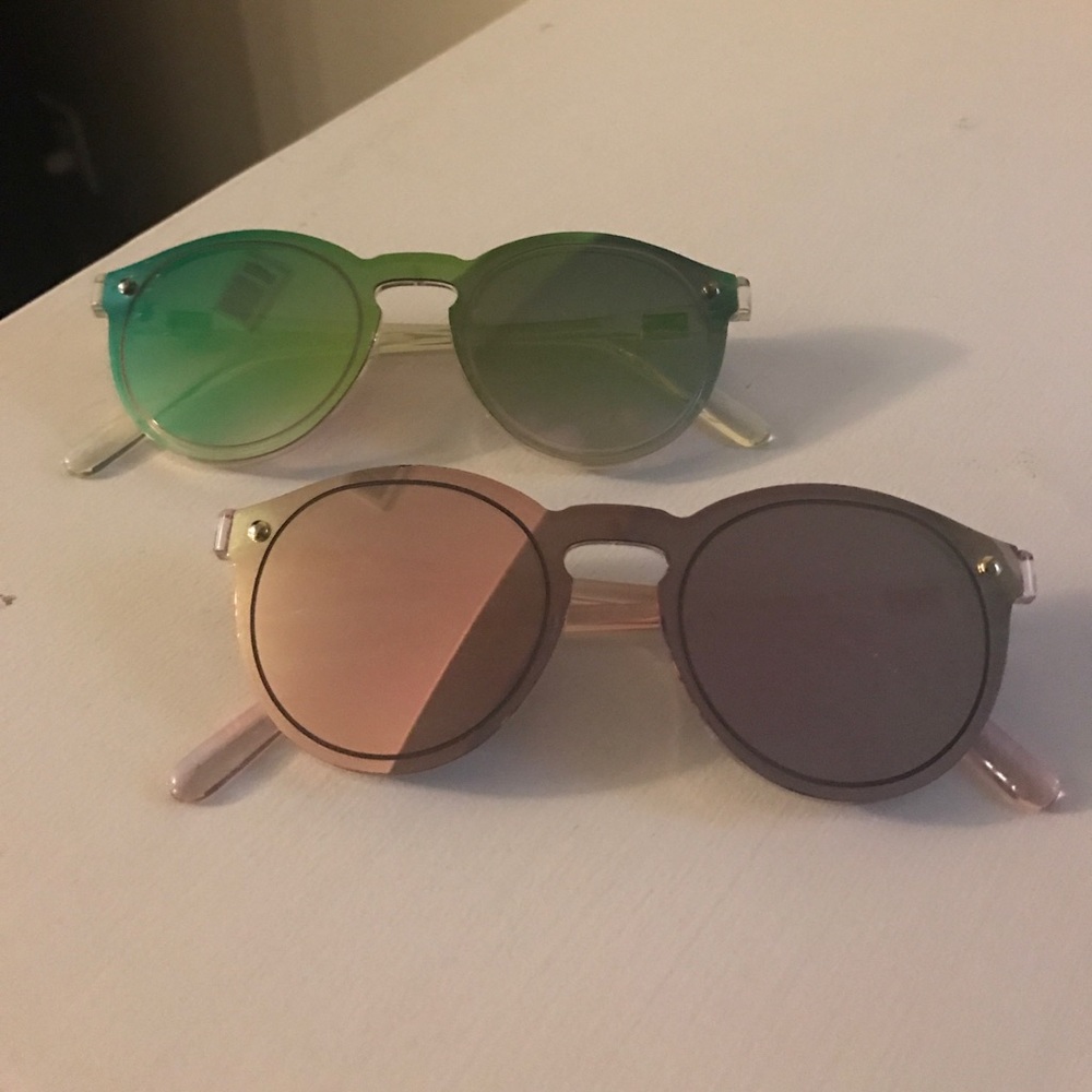 2 pair of mirrored sunglasses.