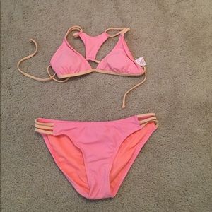 Bright pink and orange swimsuit set.