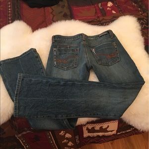 26/33 or 25/33 low rise boot cut tight jeans