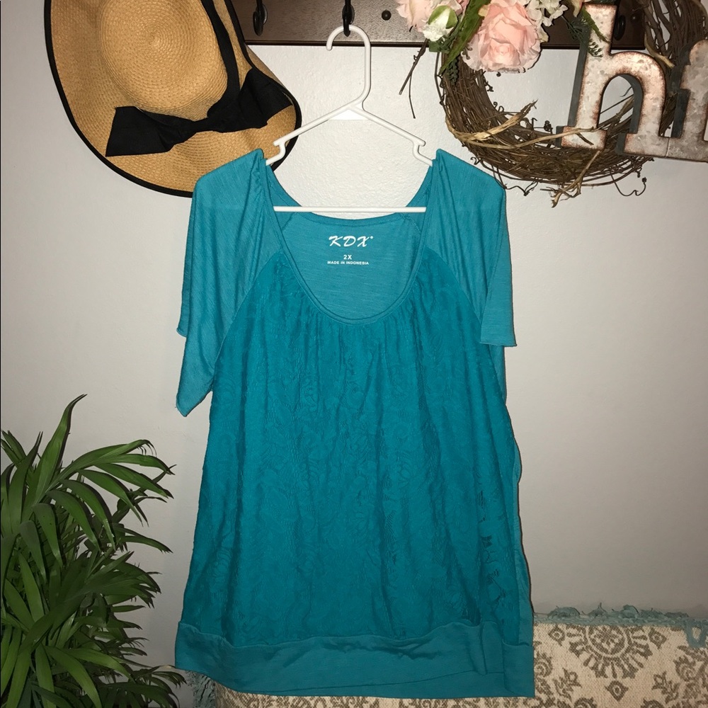 Turquoise lace shirt.