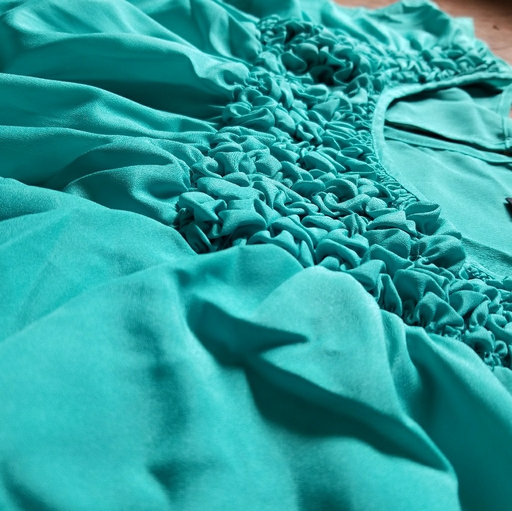 A gorgeous turquoise blouse, size small