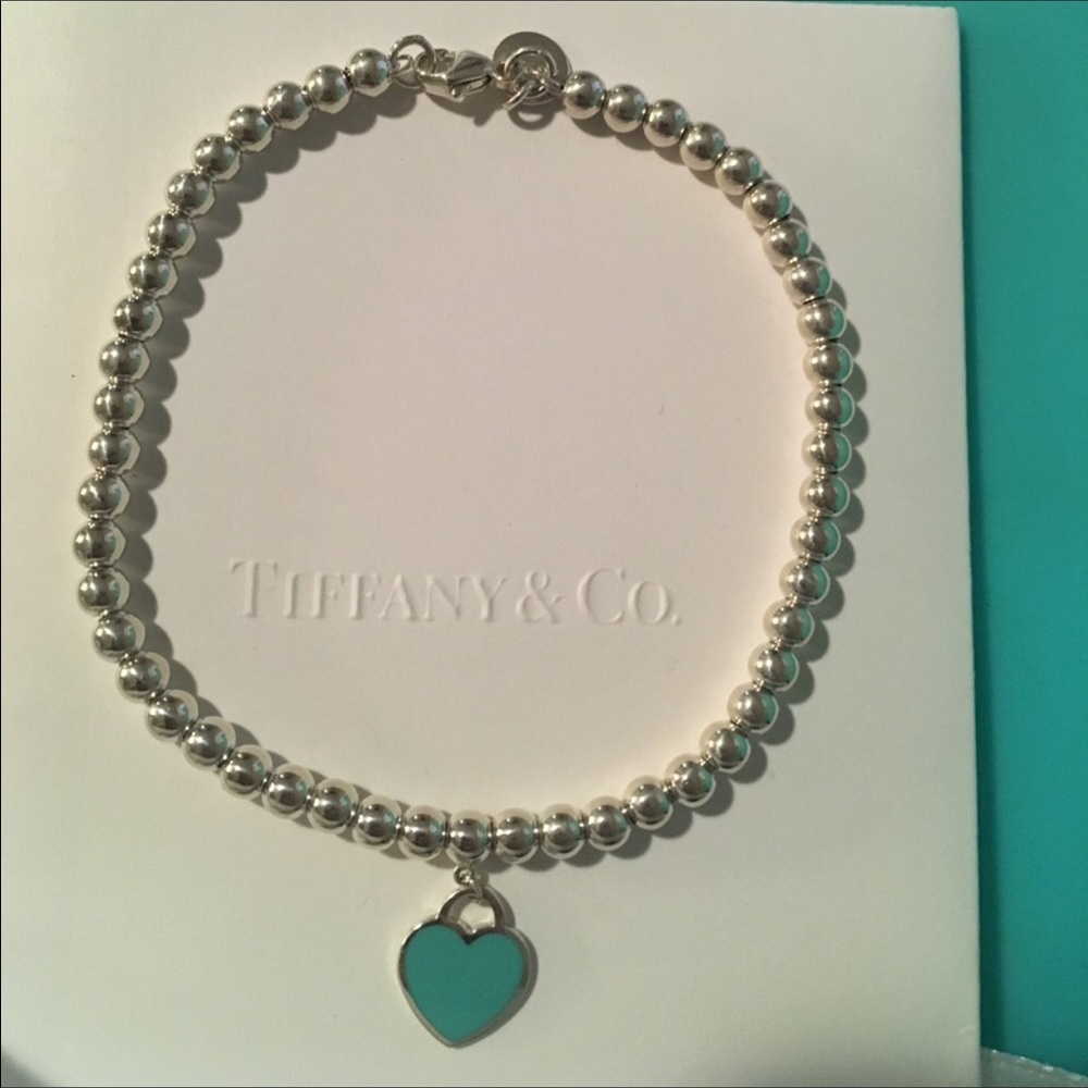 Tiffany & Co. blue enamel heart bead bracelet.