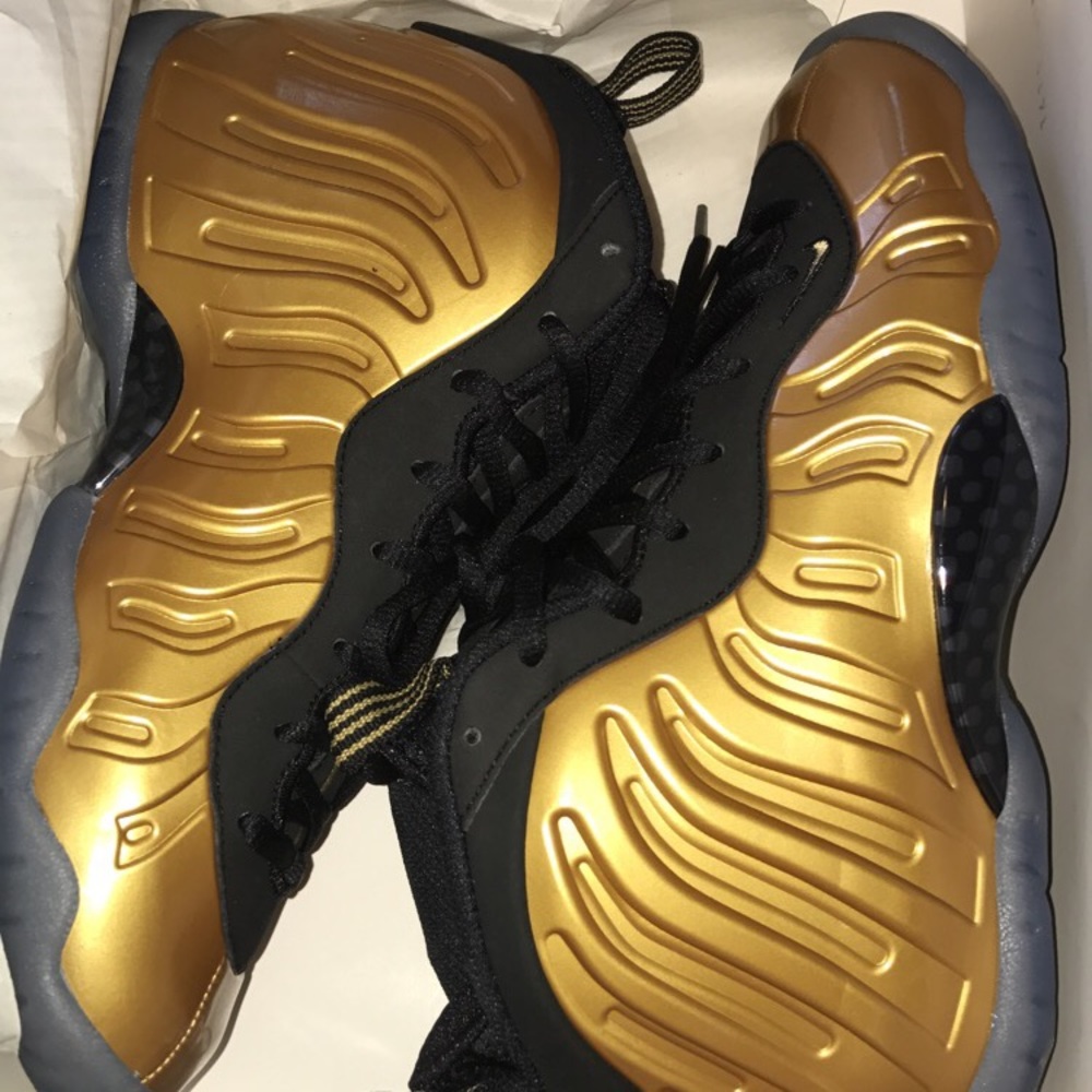 Brand new black & gold Nike little posite size 6y