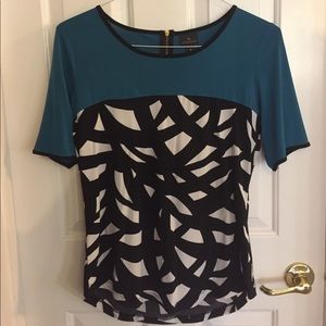 Dark teal with black/white design