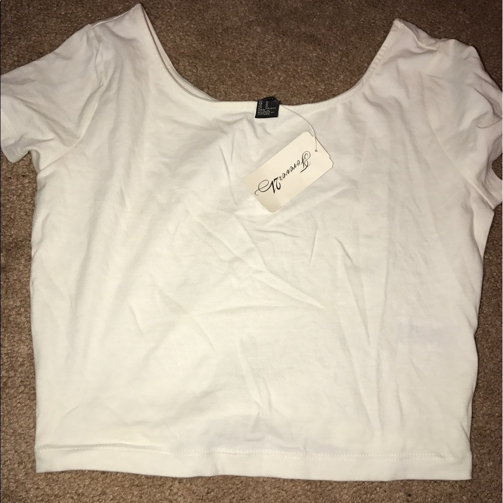 Tags on white cotton crop top