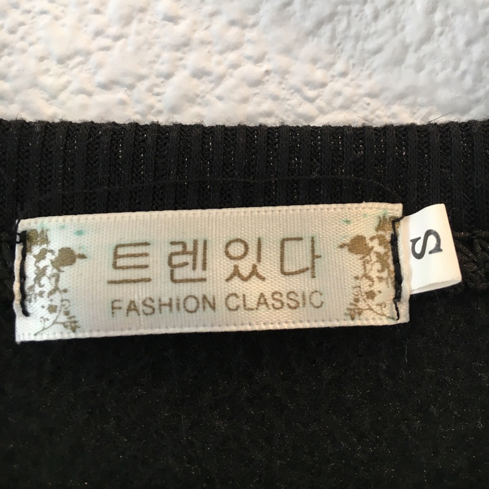 Black sweater. Never worn. - Picture 3 of 3